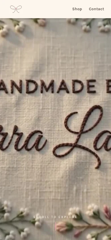 Mid-scroll on a phone: the embroidered lettering of the Handmade by Tierra LaNè hero.